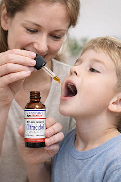 mother giving ultracidal to son